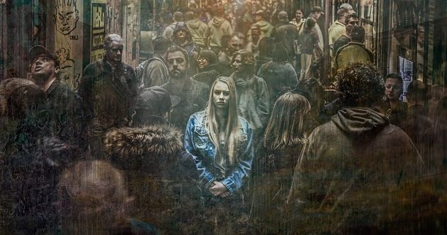 woman alone in a crowd